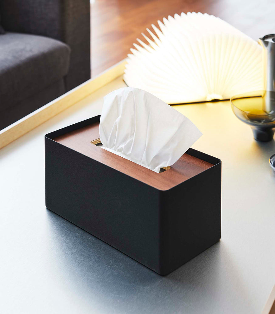 View 9 - Black Tissue Case on coffee table next to book light by Yamazaki Home.