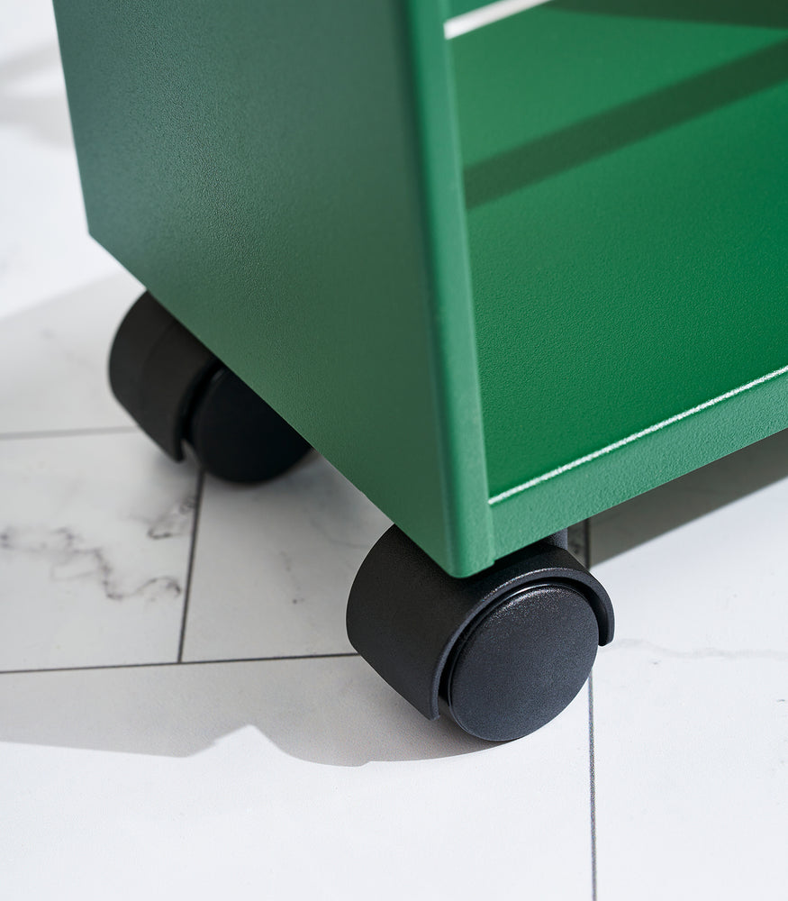 View 7 - Close up of wheels on Forest Green Yamazaki Home Slim Storage Cart