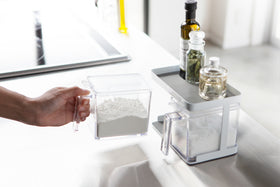 Side view of white Pantry Organizer holding flour with upper shelf by Yamazaki Home. view 5