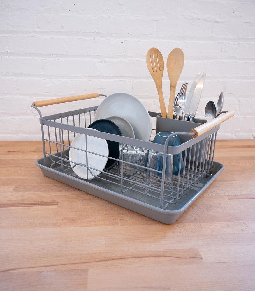 View 10 - Front view of gray Dish Rack holding plates, cups, and silverware by Yamazaki Home.