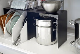 Yamazaki Black Under-Cabinet Storage Shelves holding kitchen essentials. view 10