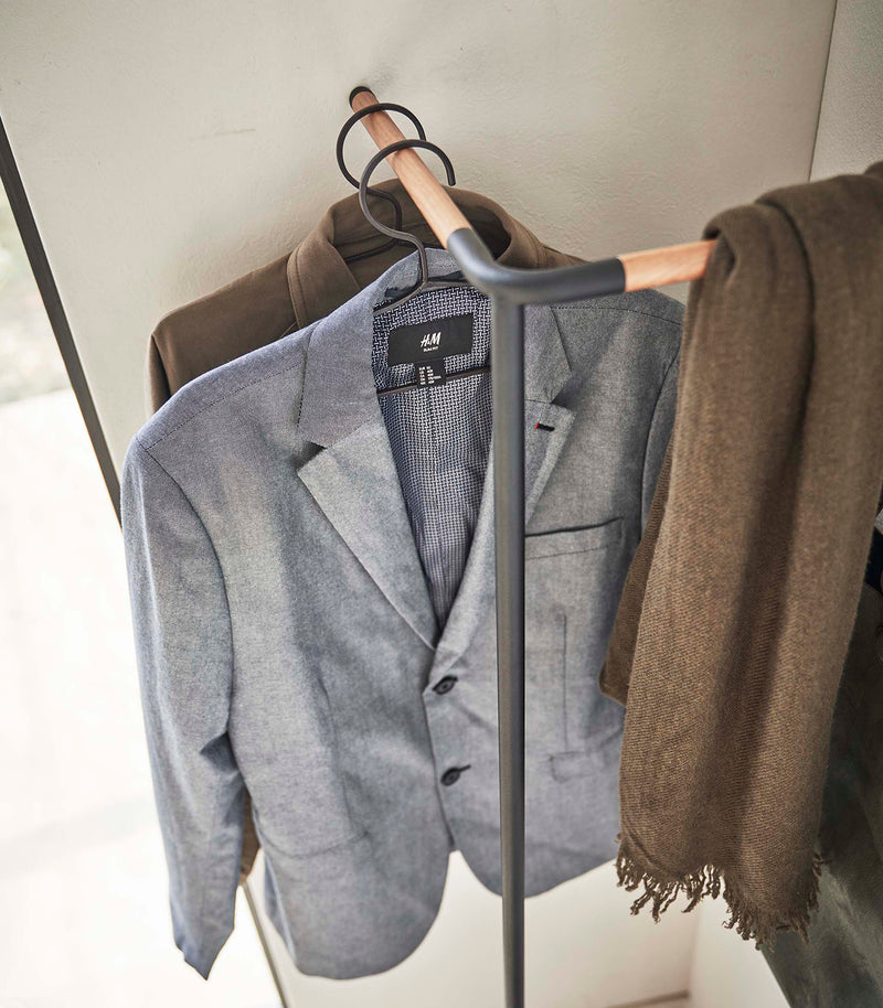 Top-down view of Yamazaki black Corner Leaning Coat Hanger