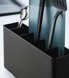 Close-up of a Black Utensil & Thin Cutting Board Holder by Yamazaki Home containing a blue cutting board and black utensils.