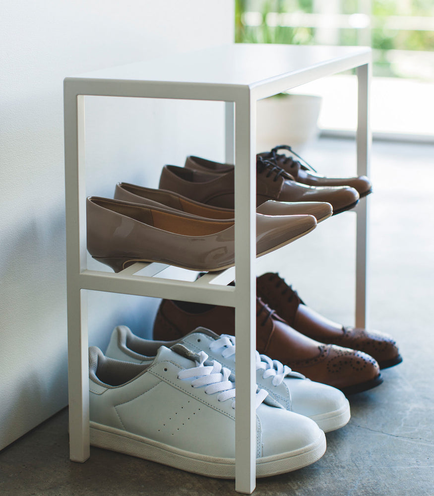 View 9 - Close-up view of white Shoe Organizer holding shoes by Yamazaki Home.