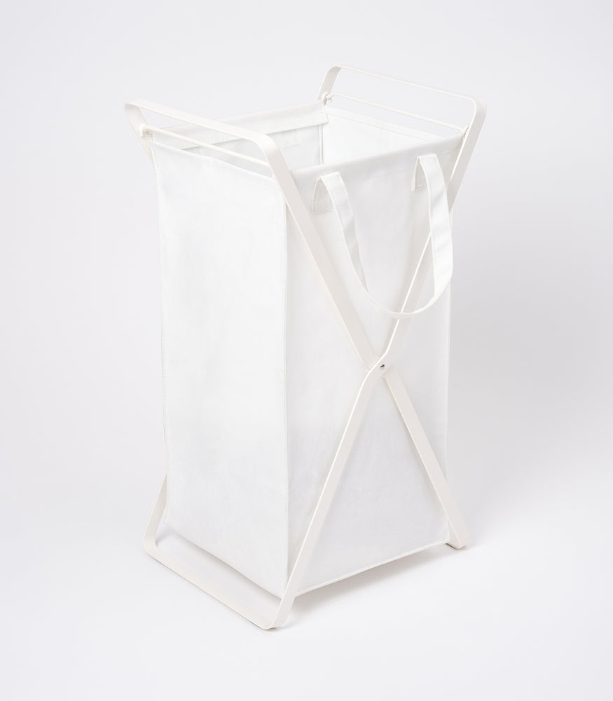 View 2 - Side view of small Laundry Hamper with Cotton Liner by Yamazaki Home in white on a white background.