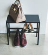 Ariel view of Black Shoe Organizer holding shoes and a purse by Yamazaki Home.