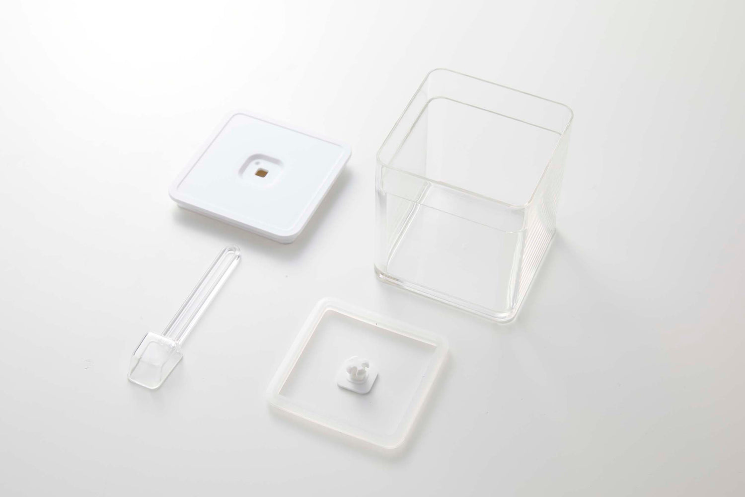 View 7 - Disassembled white Vacuum-Sealing Food Container w. Spoon on white background by Yamazaki Home.