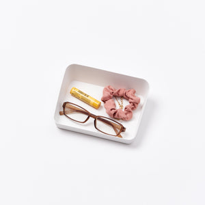 Yamazaki Home Vanity Tray - Angled - Two Sizes with props, set against a white background.