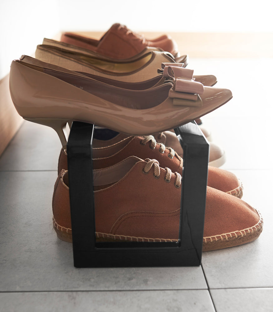 View 10 - Side view of black Expandable shoe rack by Yamazaki home.