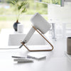 Side view of ash Yamazaki Home Hair Dryer and Iron Stand storing a hair dryer