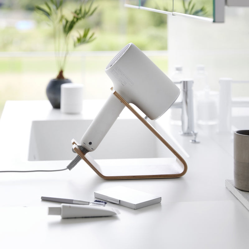 Side view of ash Yamazaki Home Hair Dryer and Iron Stand storing a hair dryer