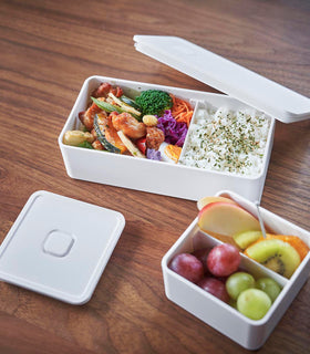 White Vacuum-Sealing Bento Box holding food on table by Yamazaki Home. view 17