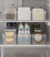 Frontal view of Yamazaki Refridgerator Organizer Bins full of food inside a refridgerator