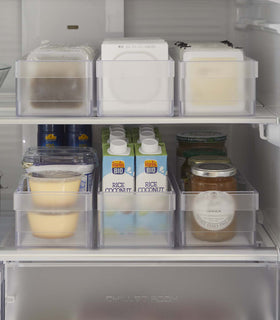Frontal view of Yamazaki Refridgerator Organizer Bins full of food inside a refridgerator view 5