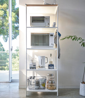 Tall white five-tier steel storage rack with a decorative wood accent bar on top shelf and white adjustable hooks on sides. view 20