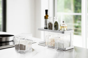 White Pantry Organizer with upper shelf holding spices and ingredients by Yamazaki Home. view 3