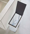 Black Yamazaki Home Lidded Garbage Bag Holder open filled with plastic bottles