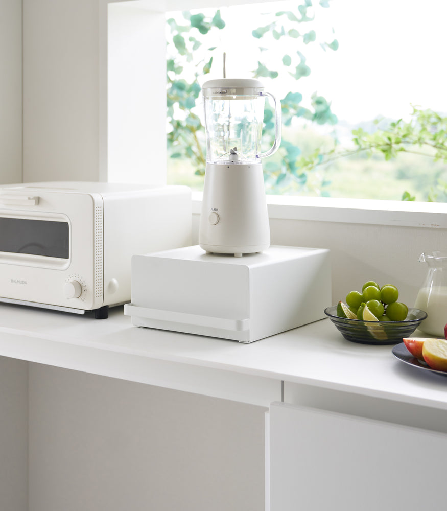 View 3 - Yamazaki Home White Countertop Rack with Drawer with a juicer.