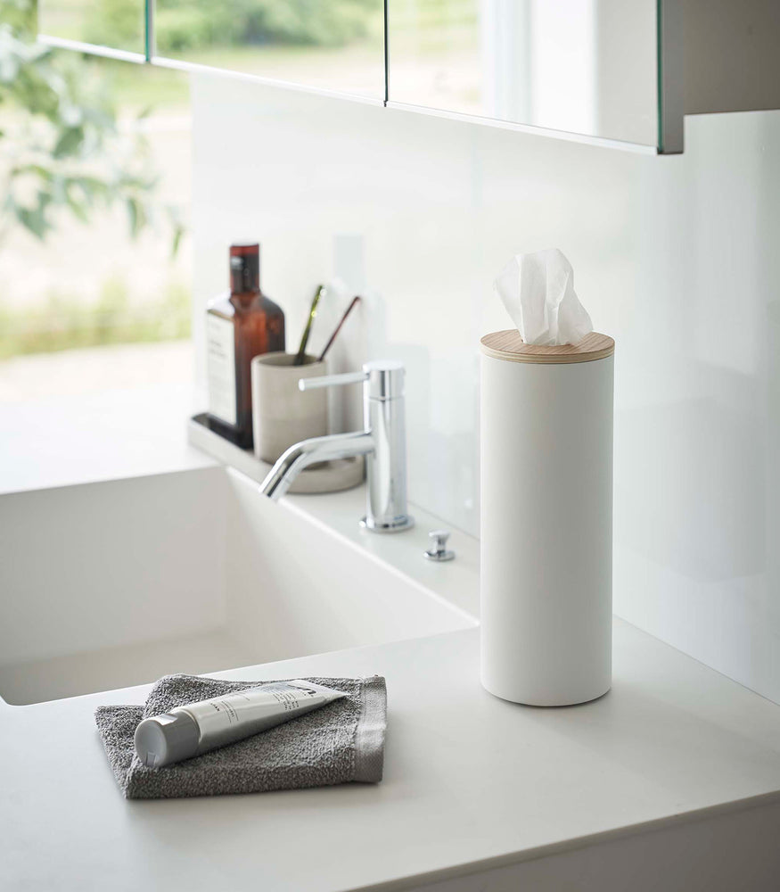 View 19 - Large White Yamazaki Home Round Tissue Case on a bathroom sink counter