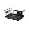 Black steel dish drying rack against a white background 
