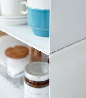 Close up of white X-Shaped Dish Rack holding cups and bowls by Yamazaki Home. view 19
