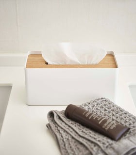 Front view of white Tissue Case on bathroom sink countertop by Yamazaki Home. view 18