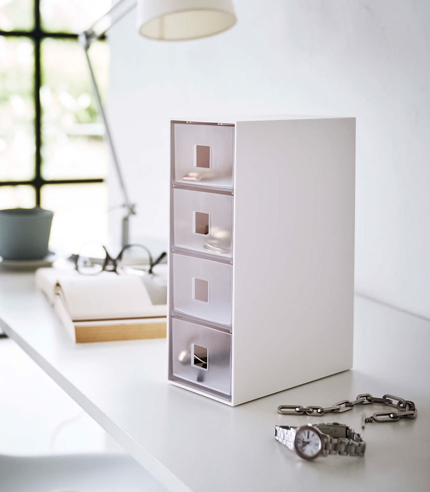 View 2 - White Yamazaki Home Storage Tower with Drawers closed and filled with accessories