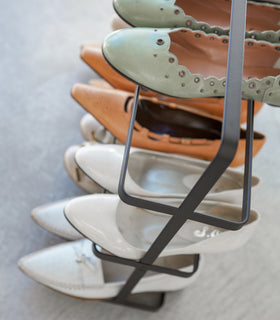 Aerial side view of Shoe Rack holding shoes by Yamazaki home. view 9