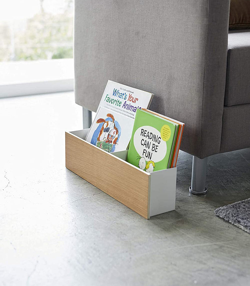 Ash Desk + Living Room Organizer holding books in living room by Yamazaki Home.