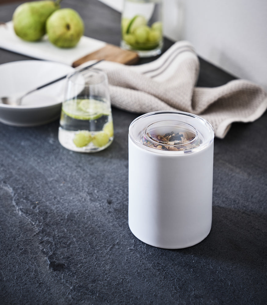 View 11 - Close up view of white Ceramic Canister on kitchen counter by Yamazaki Home.