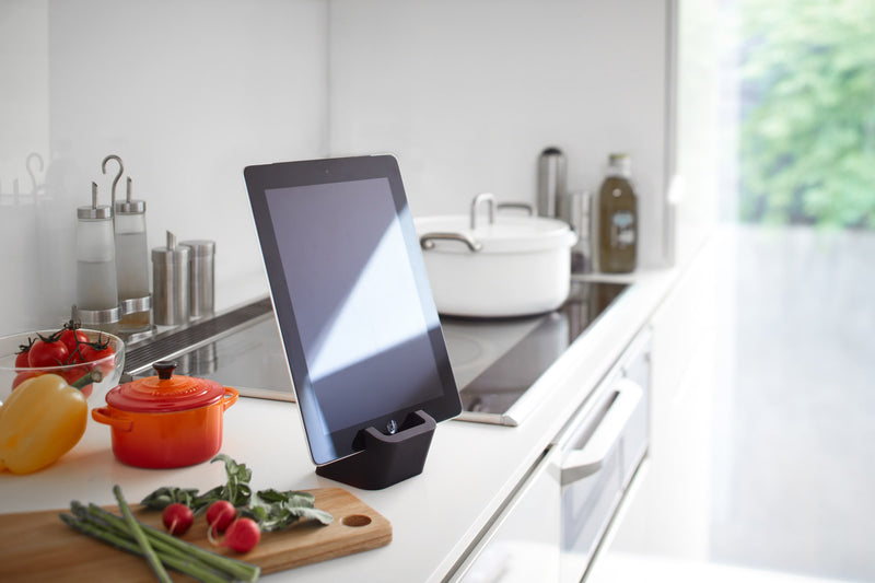 Side view of black Tablet Stand holding tablet in kitchen by Yamazaki Home.