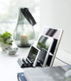 Side view of black Phone and Tablet Stand holding phone and tablet by Yamazaki Home.