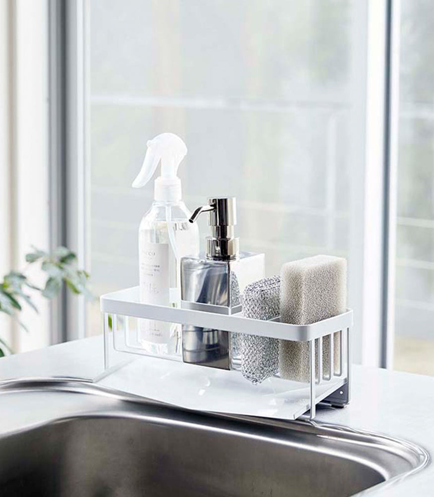 View 3 - White steel sponge and soap bottle holder with white draining tray.