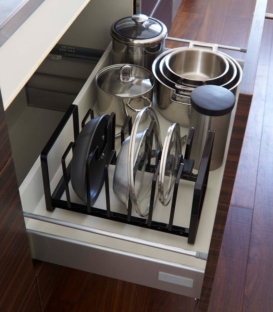 View 8 - Adjustable black steel pot lid and frying pan organizer.