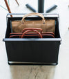 Aerial front view of black Storage Hamper holding bags by Yamazaki Home.