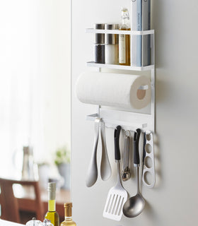 White Magnetic Organizer on kitchen fridge holding kitchen tools by Yamazaki home. view 6