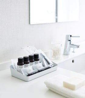 With Accessory Tray with beauty products and oils in bathroom by Yamazaki Home. view 12