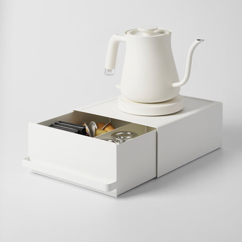 Yamazaki Home Countertop Rack with Drawer with props, set against a white background.