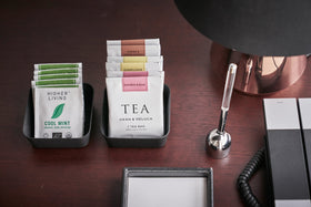 Aerial front view of black Accessory Trays holding tea bags on desk by Yamazaki Home. view 11