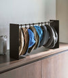 Shortened black Yamazaki Home hat rack hanging a variety of hats