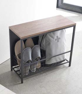 Black Yamazaki Discreet Entryway Storage Shelf filled with slippers and a backpack view 14