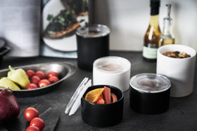White Ceramic Canisters holding food items on kitchen countertop by Yamazaki Home. view 4
