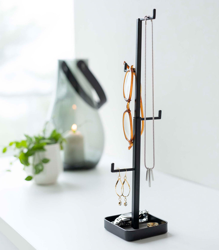 View 10 - Black Yamazaki Home Tree Accessory Stand with various accessories shown