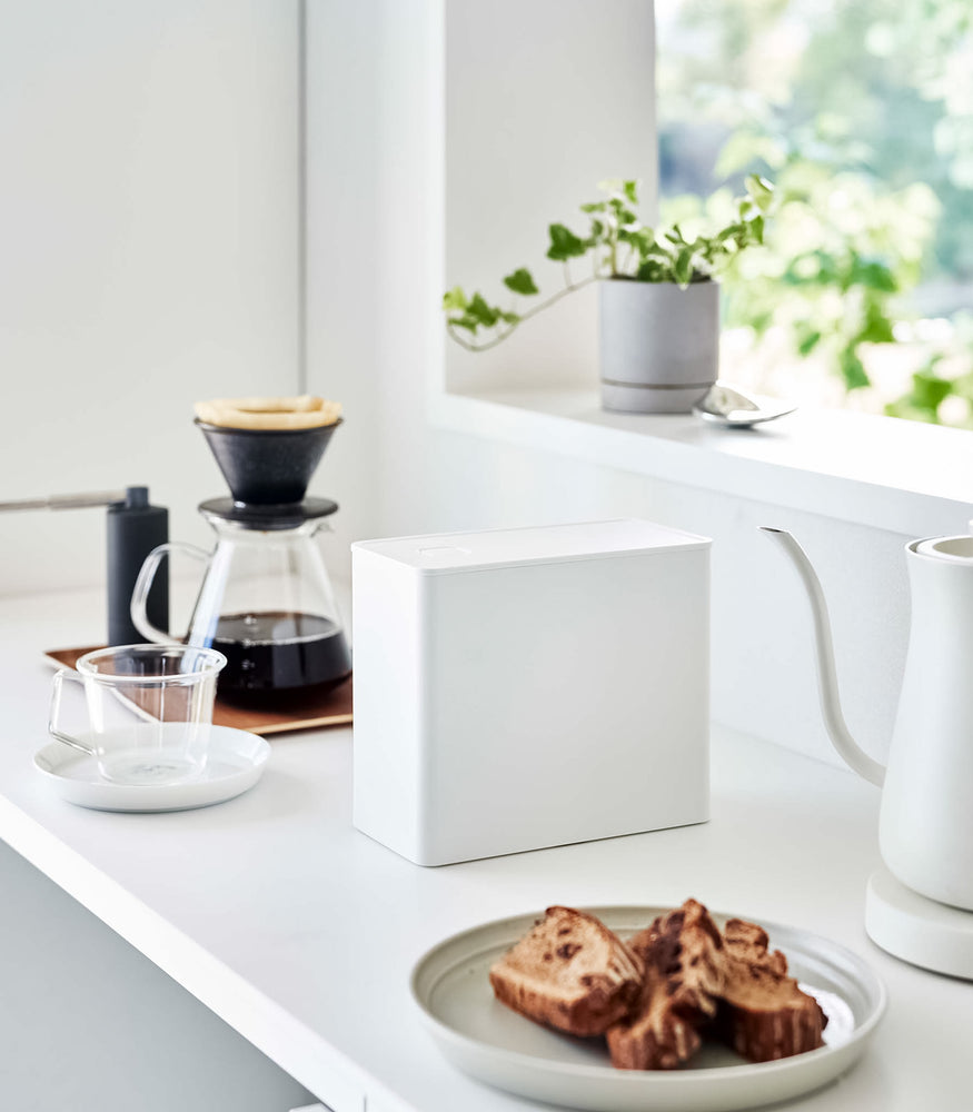 View 4 - White Yamazaki Home coffee storage container with a closed lid on countertop