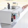 Side view of white Yamazaki Home Front-Opening Kitchen Countertop Storage Rack fully opened