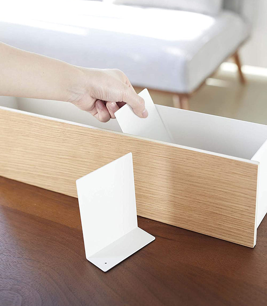 View 15 - White Desk Organizer with dividers being inserted by Yamazaki Home.