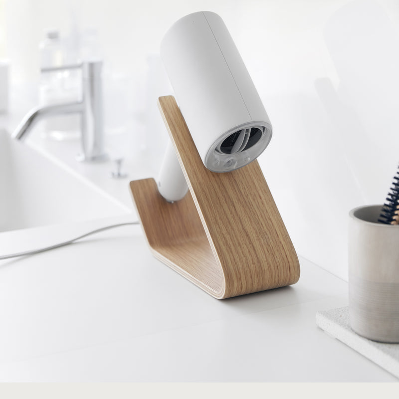 Hair dryer stored on ash Yamazaki Home Hair Dryer and Iron Stand