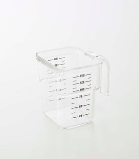 Clear measuring cup on white background by Yamazaki Home. view 35