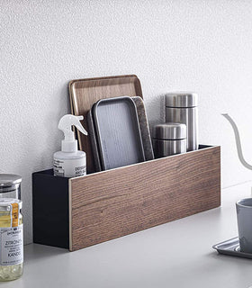 Black Desk Organizer holding cleaning items, trays, and containers by Yamazaki Home. view 20