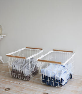 Wire Laundry Baskets holding towels and laundry by Yamazaki Home. view 4